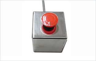 An optional external emergency pause button can be used as a safety measure.